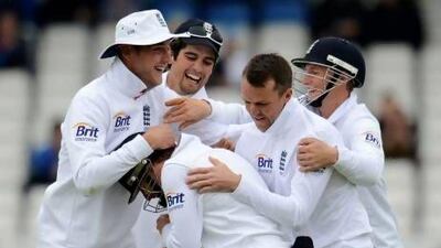 England's Ian Bell is mobbed by teammates Stuart Broad, left, Alastair Cook Graeme Swann, second from the right, and Joe Root after England's victory in the Second Test against New Zealand. Afterward, Cook Afterward, Cook dismissed criticism of his tactics and strategy. .