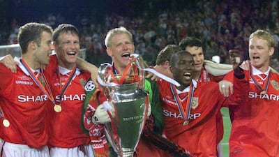 United players pose with the European Cup after the game. AFP