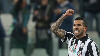 Carlos Tevez celebrates after scoring during a Serie A match with Juventus in April. Marco Bertorello / AFP / April 29, 2015