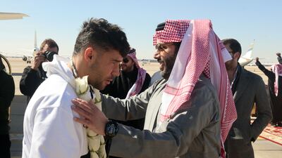 PSG's Juan Bernat is welcomed by Turki Al Sheikh, an advisor at the Royal Court and head of Saudi Arabia's General Entertainment Authority. Reuters