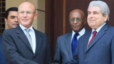 President Demetris Christofias, right, shakes hands with the Turkish Cypriot leader Mehmet Ali Talat at the residence of the UN Secretary-General's Special Representative in Cyprus on July 25.