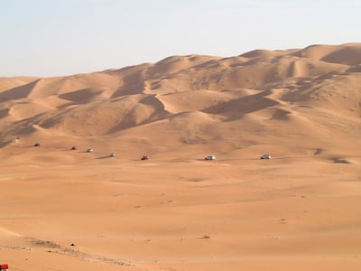 A caravan of 4x4 vehicles navigate the dunes in the Empty Quarter, Liwa. Paolo Rossetti for The National