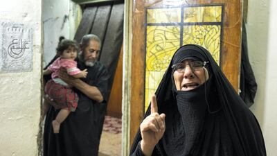 Layla Abbas Hussein, mother of two slain protesters crying over her sons. Haider Husseini for The National