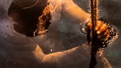 A photo of a pearl diver on display in the Pearl Museum at National Bank of Dubai building in Dubai. Pawan Singh / The National