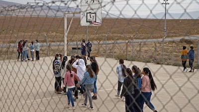 Girls walk in the recreation ground at a school in a Yazidi displacement camp in the Sharya area, 15 kilometres from the city of Dohuk in Iraqi Kurdistan. AFP
