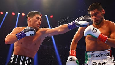 Dmitry Bivol throws a left at Gilberto Ramirez. Getty