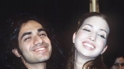 Ivanka Trump, wearing a red T-shirt and grey sweatpants, and designer Anand Jon at his runway show on February 15, 1999. Getty Images
