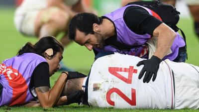 Will Hooley of the US receives medical attention during the Rugby World Cup Pool C match. Reuters