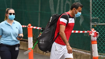 Croatia's Ivan Dodig walks to a practise session in Melbourne. AFP