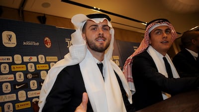Miralem Pjanic and Paulo Dybala of Juventus wear the ghutra at the Juventus SELA sponsor event in Jeddah on Monday. Photo: Getty