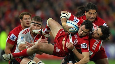 The Queensland Reds overcame a stiff challenge from the Canterbury Crusaders to win their first Super 15 title on Saturday.