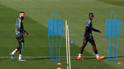 Real Madrid's Karim Benzema and Ferland Mendy. Reuters