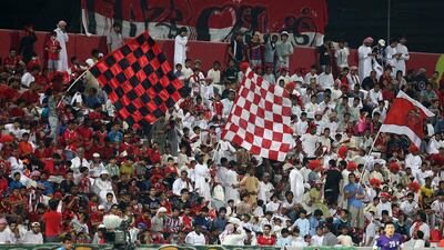 Al Ahli fans support their club during the Asian Champions League last 16 first leg against Al Ain in Dubai. Pawan Singh / The National / May 20, 2015