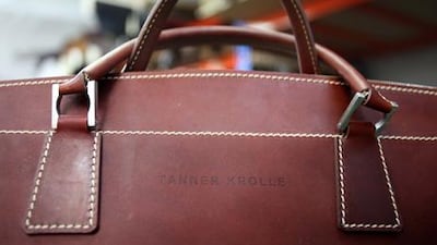 A finished travel case bears the brand’s name.