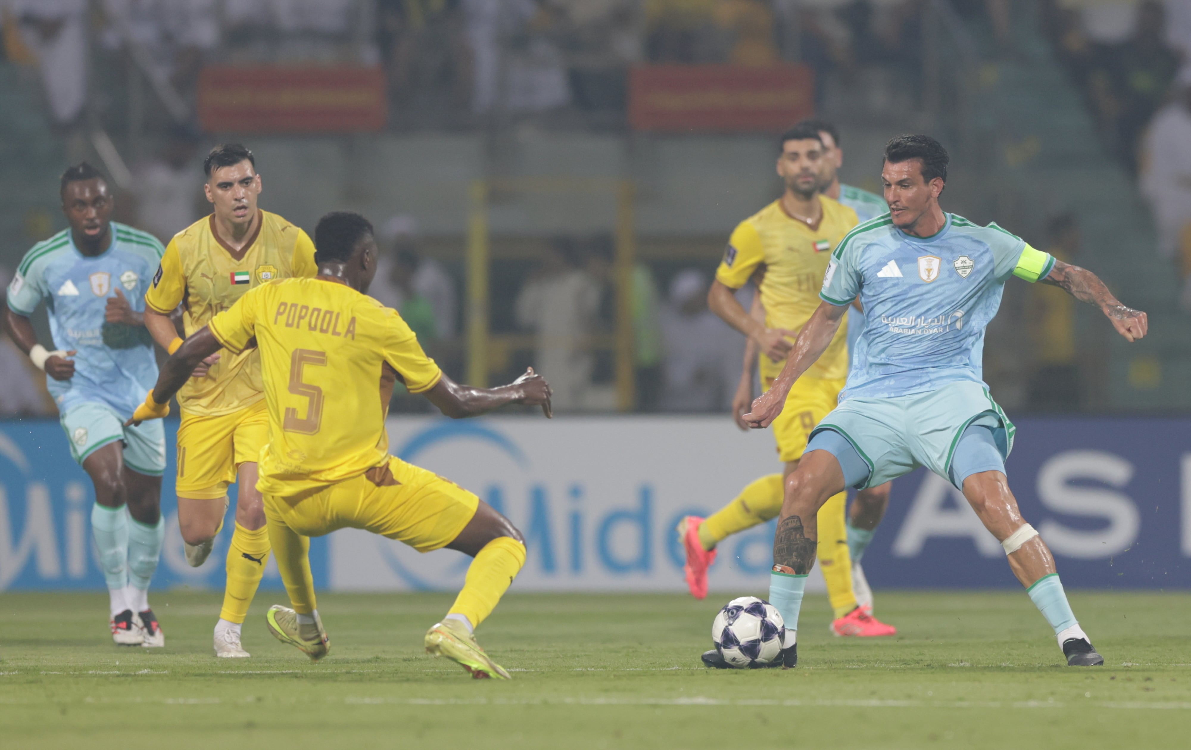 Al Ahli's Roger Ibanez, right, in action against Al Wasl. EPA