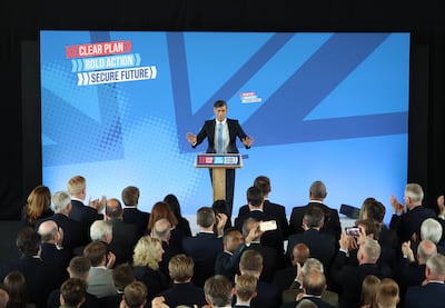 Rishi Sunak delivers the party's election manifesto at Silverstone race track. EPA