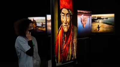 More than 150 large-format photographs by renowned American photographer Steve McCurry are being exhibited at Musee Maillol in Paris.