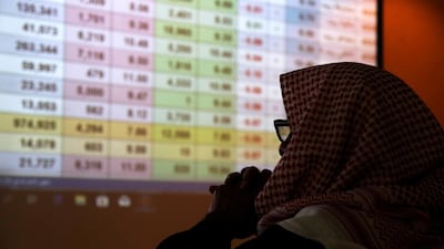 A Saudi trader monitors stocks at the Saudi stock market in Riyadh. The kingdom is moving forward with its privitisation plans and listing of companies on the local capital market. Reuters