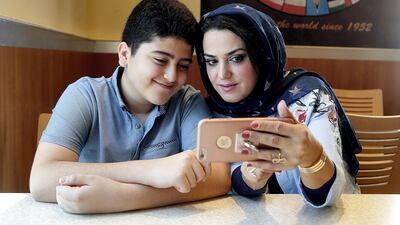 Raldah Bourhan started taking a greater interest in the media her son Elaf, 12, consumed after finding out a man was asking him questions in a chatroom. Satish Kumar for The National