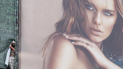 A worker watches clashes between policemen and students during a protest in Milan. Thousands of union workers and students staged a general strike through more than 50 Italian cities to protest government reforms that they say erode workers’ rights. Luca Bruno / AP Photo