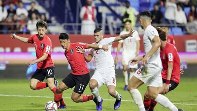 South Korea's Hwang Hee-chan, No 11, vies for the ball with Alvaro Silva, No 2, of the Philippines. South Korea won 1-0.