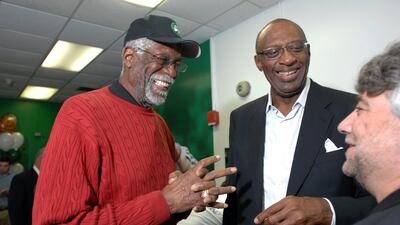 Former NBA players Bill Russell, left, and Bob Lanier share a laugh during the ceremonial opening of a new reading and learning centre at a community centre in Boston. AP