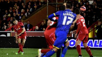 Steven Gerrard of Liverpool scores his team's second goal from a free kick during the FA Cup third round match against AFC Wimbledon. Michael Regan / Getty Images