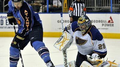 Ty Conklin, No 29, made 38 saves for the Blues. His team still lost to the Thrashers on Sunday.