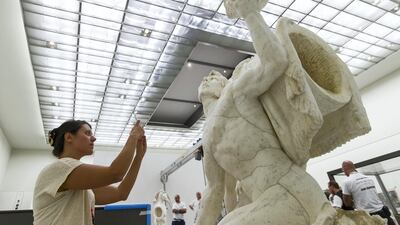 The colossal statue depicts the Greek god Apollo's horses groomed by two tritons. Christopher Pike / The National