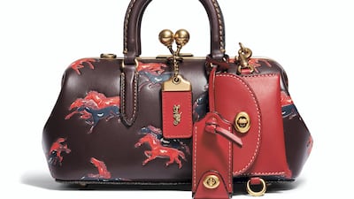 Horses in pairs and trios run across this sophisticated leather bag