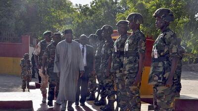 Nigerian president Goodluck Jonathan(CL) inspects soldiers of the 7 Division of the Nigerian Army fighting Boko Haram militants during a visit to Maiduguri on January 15. AFP Photo