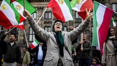 Iranian activists shout slogans during a protest against the government in Tehran, in Amsterdam, The Netherlands. EPA