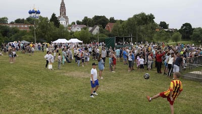 People attend the party organised by the village of Bronnitsy, where Argentina's base camp is located, near Moscow, Russia, to celebrate the birthday of Argentine forward Lionel Messi. AFP