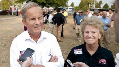 Republican Todd Akin and his wife Lulli, pictured attending a ham breakfast at the Missouri State Fair. Mr Akin’s comments that ‘legitimate rape’ is unlikely to cause pregnancy have bolstered the Democrats’ campaign for a second week.
