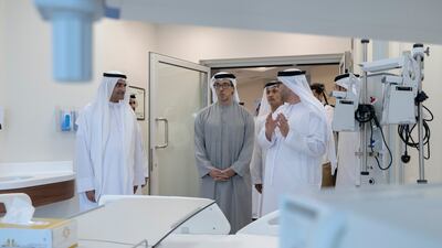 FUJAIRAH, UNITED ARAB EMIRATES - July 07, 2025: HH Sheikh Mansour bin Zayed Al Nahyan, UAE Vice President and Deputy Prime Minister (C) and HH Sheikh Hamad bin Mohamed Al Sharqi, UAE Supreme Council Member and Ruler of Fujairah (L), attend the inauguration of Sheikh Khalifa Hospital. ( Hassan Bargash Al Menhali / UAE Presidential Court ) ---
