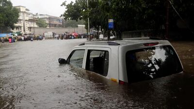 Rising waters in Mumbai brings the economy to a standstill. Rajanish Kakade / AP Photo