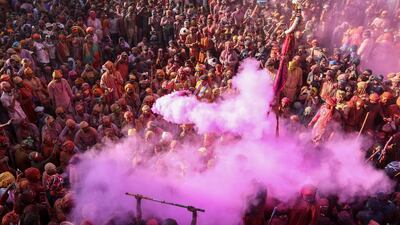 Revellers celebrate Lathmar Holi, the Hindu spring festival of colours, in Nandgaon, India. AFP