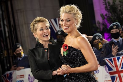Sharon Stone, left, and Hannah Waddingham arrive at the Pride of Britain Awards on Saturday, October 30, 2021, in London. AP Photo