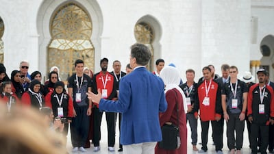 Tim Shriver, Special Olympics Chairman, tours the mosque with the teams. Wam