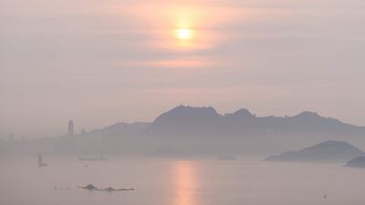 The sun rising in Hong Kong. Anthony Wallace / AFP Photo