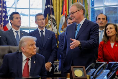 National Economic Council director Kevin Hassett speaks with US President Donald Trump in the Oval Office. Reuters
