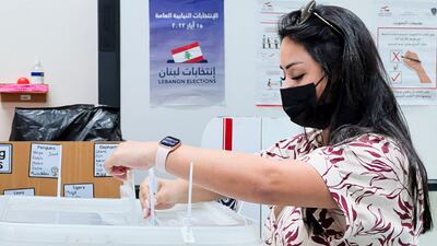 A Lebanese expat casts her vote in Lebanon's parliamentary election at the Lebanese school in Doha, Qatar. Reuters