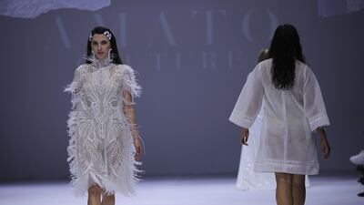 Models on the catwalk during the Amato Couture show. EPA