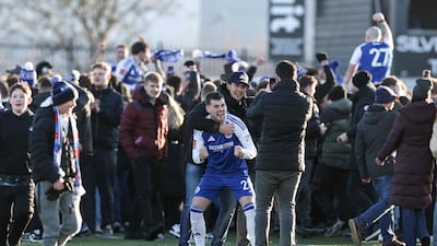 Macclesfield's James Edmondson celebrates with fans after the sixth-tier side defeated Premier League Crystal Palace. AFP