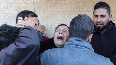 A woman mourns loved ones killed during Israeli bombardment, at Al Aqsa hospital in Deir El Balah in central Gaza. AFP