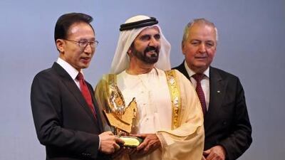 Sheikh Mohammad Bin Rashid, Vice President of the UAE and Ruler of Dubai, awards the 2011 Zayed International Prize for the Environment to South Korean president Lee Myung-bak as chairman of the international jury Klaus Toepfer, right, watches.