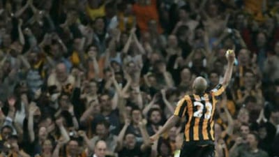 The Hull striker Marlon King celebrates victory over Arsenal.