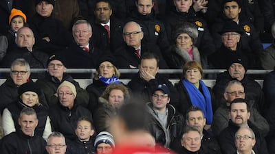 Sir Alex Ferguson, second left in second top row, has been a regular spectator at Manchester United games since stepping down as manager at the end of last season. Rebecca Naden / Reuters