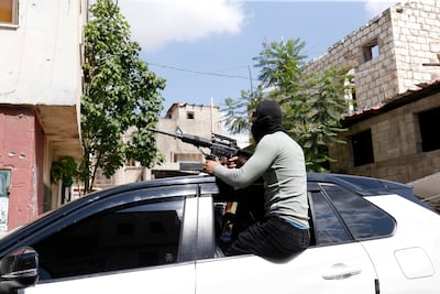 A Palestinian militant in Jenin. The armed opposition to Israeli forces in the area was led by organisations that do not answer to the Palestinian Authority. EPA