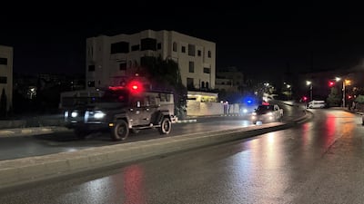 Police patrol a street near the Israeli embassy in Amman on Sunday. A gunman was shot dead after he had opened fire on officers. Reuters